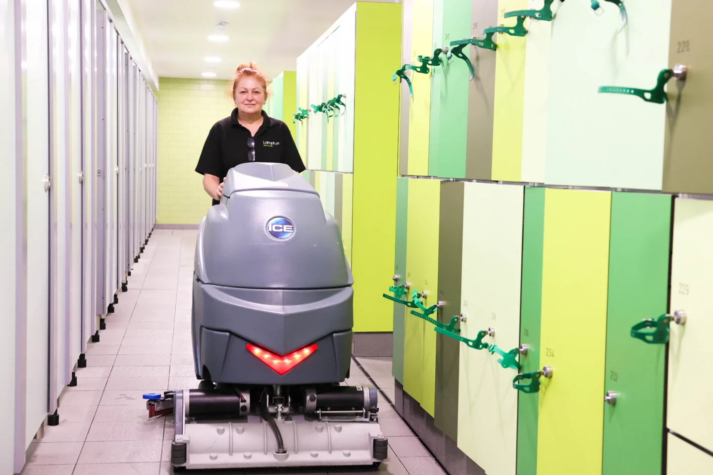 Person using a cleaning machine in a leisure centre